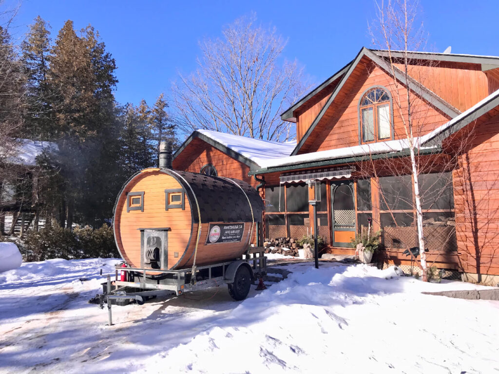 Round Economy Plus mobile sauna set up for a winter rental